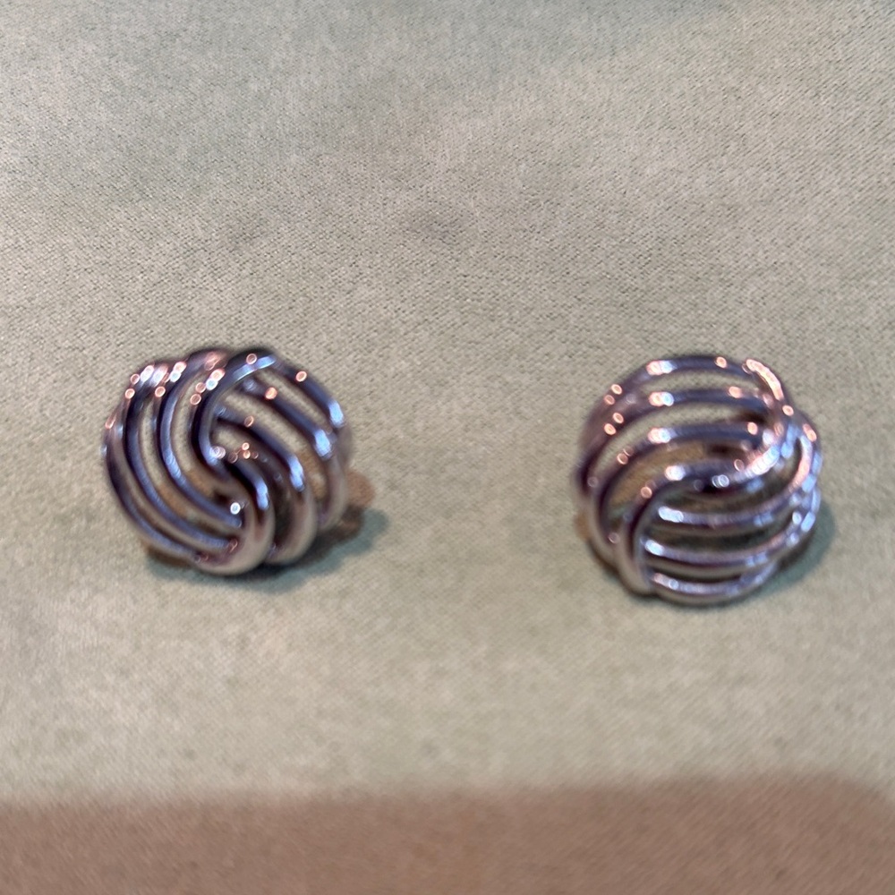 Silver earrings.